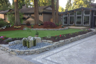 Driveway with low Basalt garden wall