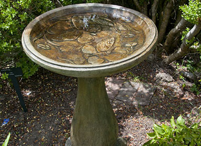 Birdbath with a butterfly pattern designed by Castart Studios