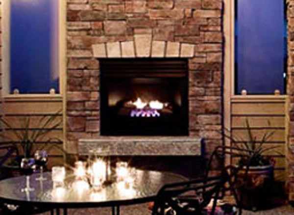 Fireplace built with Country Ledgestone in a garden