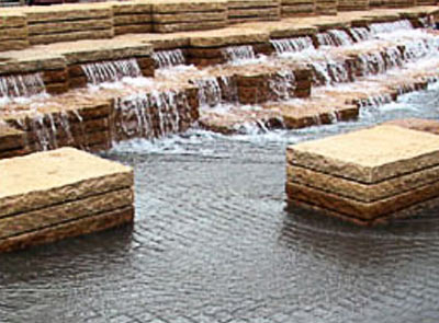 Water flowing through Mutual Materials pavers into a fountain