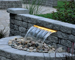 Model of lighted waterfall features by Atlantic Colorfalls System on a garden wall
