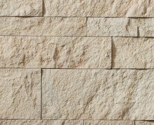 Cultured stone foundation by Hewn Stone